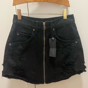 Brand new never worn black denim skirt. Brand is carmar no flaws!!